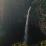 Beautiful view of Nohkalikai Falls cascading down lush cliffs in Meghalaya, India.