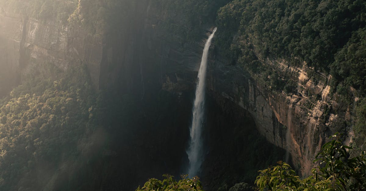 Beautiful view of Nohkalikai Falls cascading down lush cliffs in Meghalaya, India.