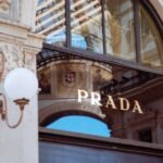 Refined facade of Prada in Galleria Vittorio Emanuele II, Milan, showcasing luxury fashion.