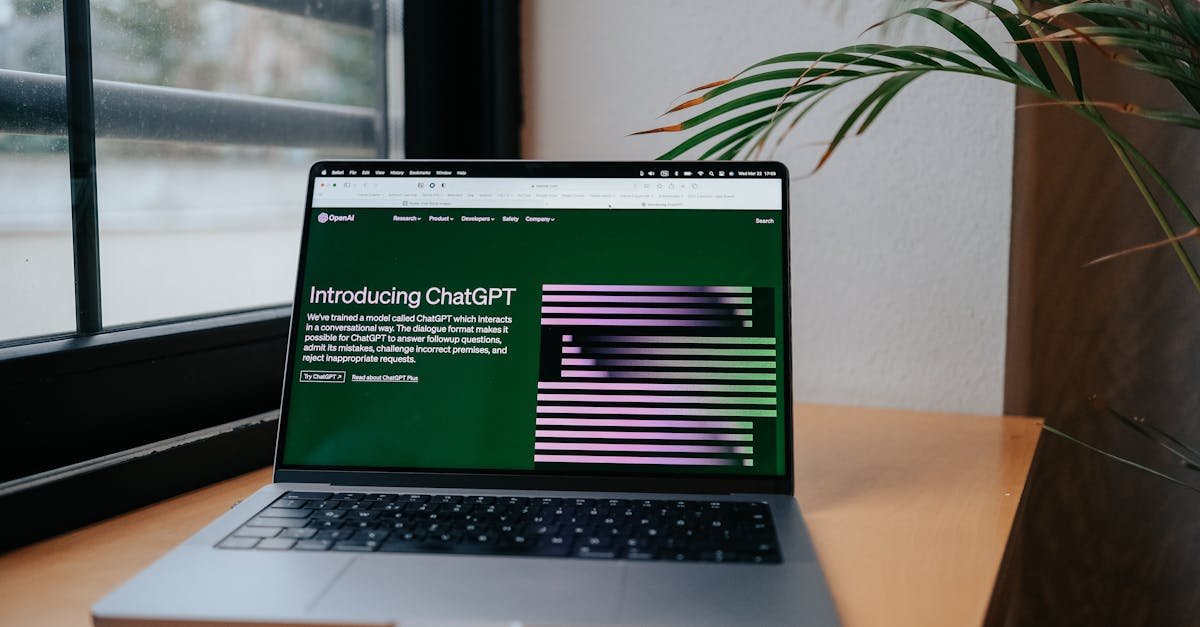A laptop displaying ChatGPT on a desk by a window, featuring a modern home office setup.