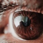 Detailed macro shot of a human eye capturing intricate details of the iris and reflections.