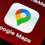 Detailed view of Google Maps app icon on a smartphone screen, showcasing digital navigation technology.