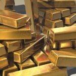 A pile of lustrous gold bars symbolizing wealth and prosperity.
