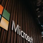 Interior view of Microsoft office with logo on wooden wall in Brussels, Belgium.