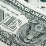 Detailed macro shot of a United States one dollar bill showing various design elements.