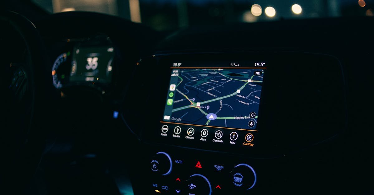 Interior view of a car featuring the GPS navigation system illuminated at night, showcasing technology and modern travel.